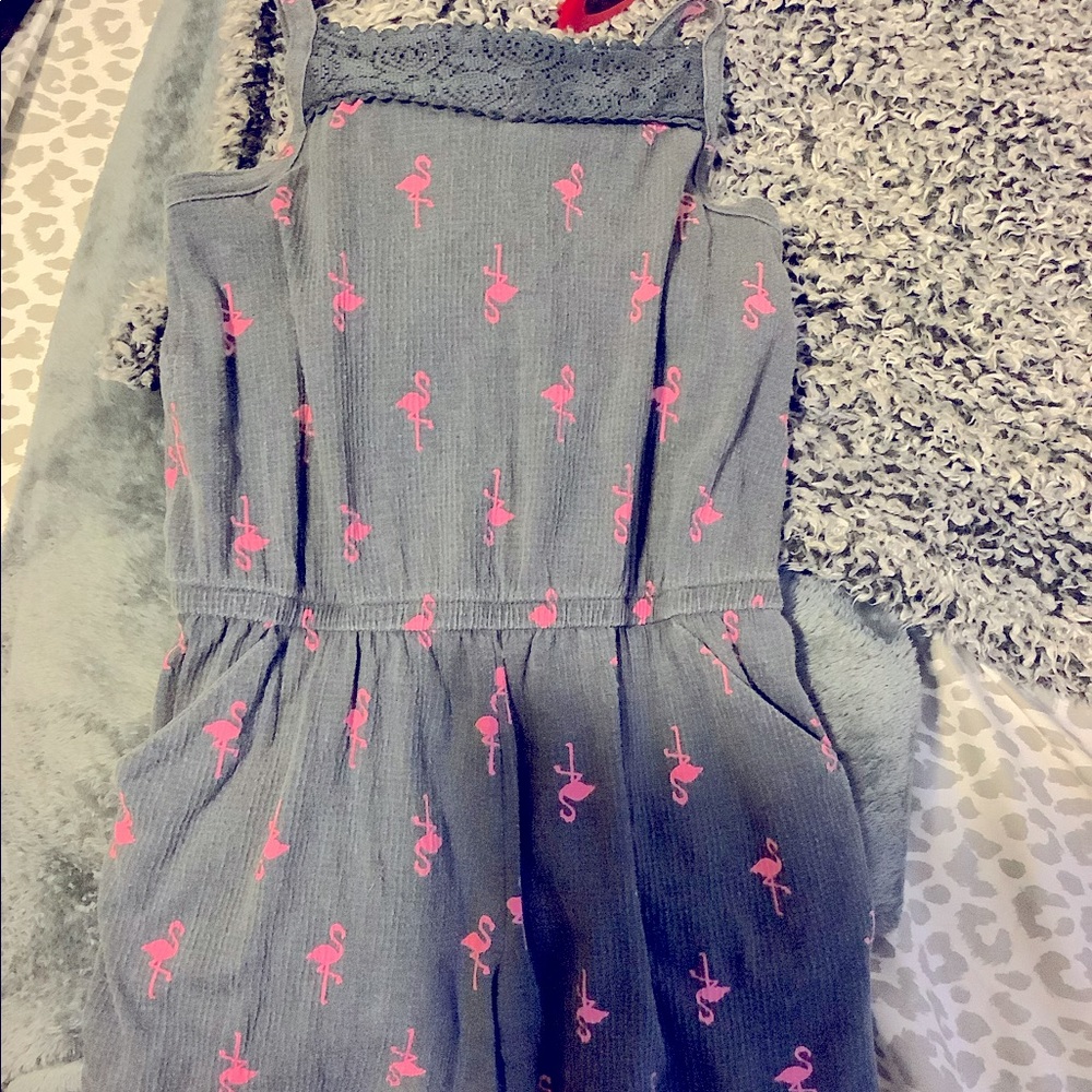 This is a cute gray and pink romper with flamingos and it’s great for summer.